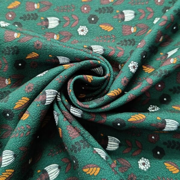 Tessuto Crepe elasticizzato a fantasia motivo astratto nero - verde - ocra - bainco