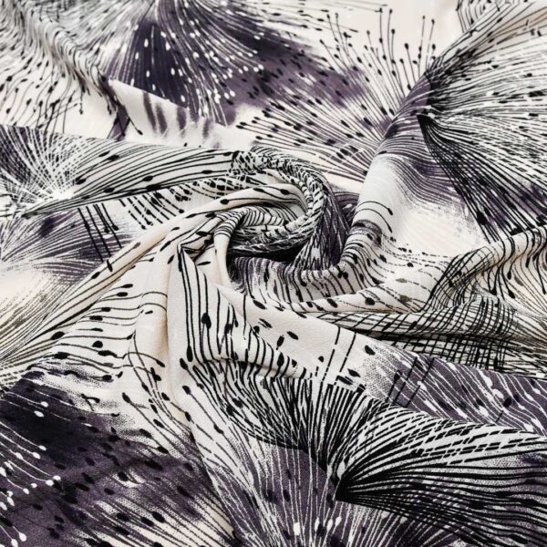 Tessuto Crepe a fantasia motivo astratto vinaccio - nero