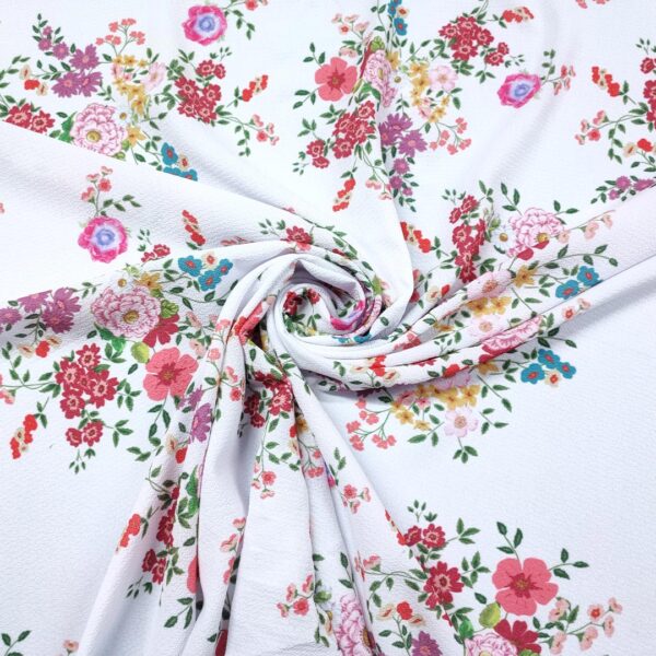 Tessuto Crepe a fantasia motivo bianco - rosso - corallo - lilla