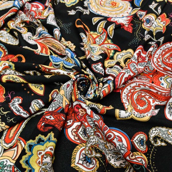 Tessuto Crepe a fantasia motivo floreale cashmere nero - rosso - giallo