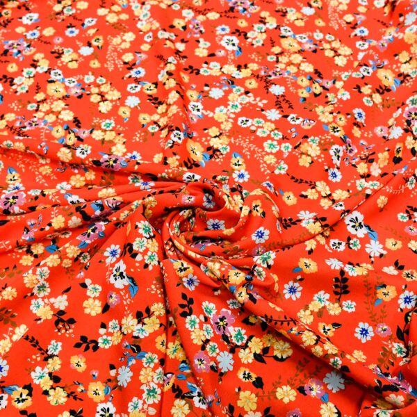 Tessuto Crepe a fantasia motivo floreale rosso - celeste - lilla