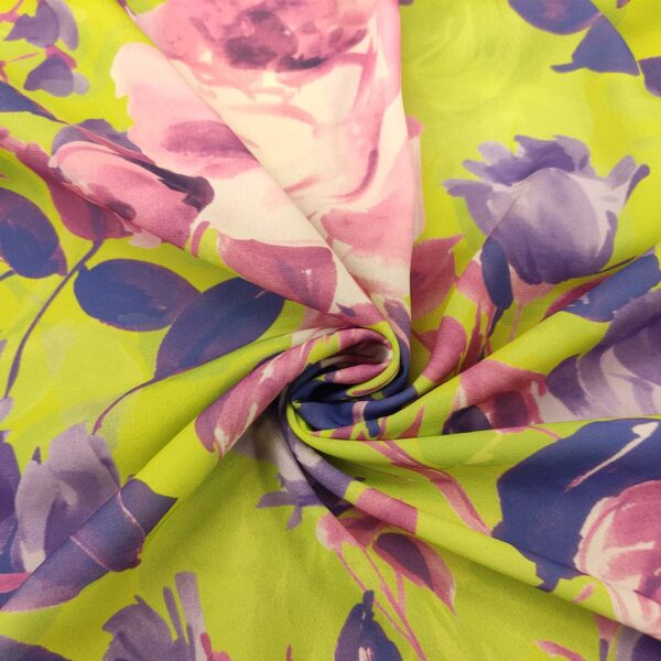 Tessuto Crepe a fantasia motivo floreale verde fluo - viola - rosa