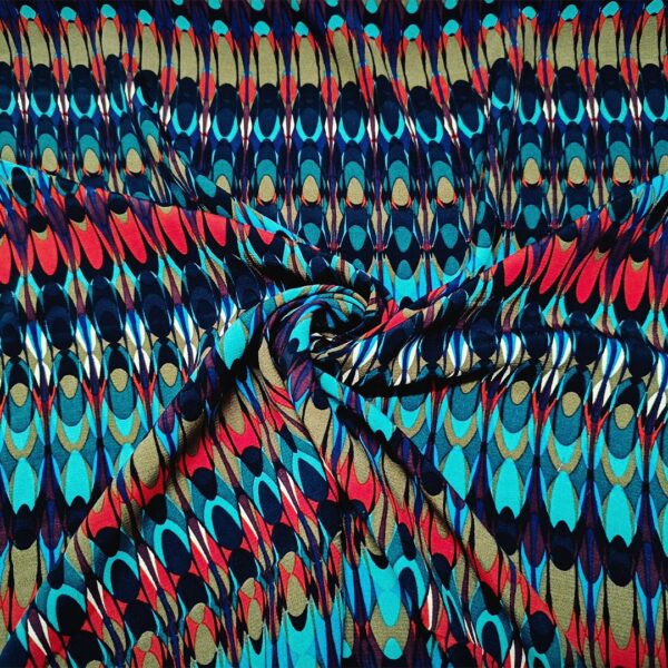 Tessuto Crepe a fantasia motivo geometrico turchese - rosso - nero