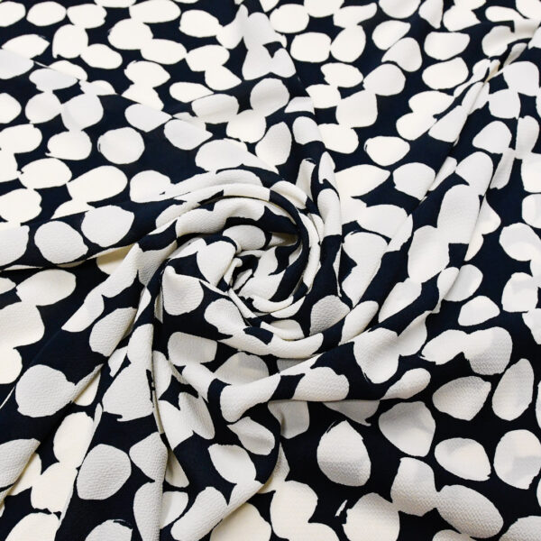 Tessuto Crepe a fantasia motivo astratto blu - bianco