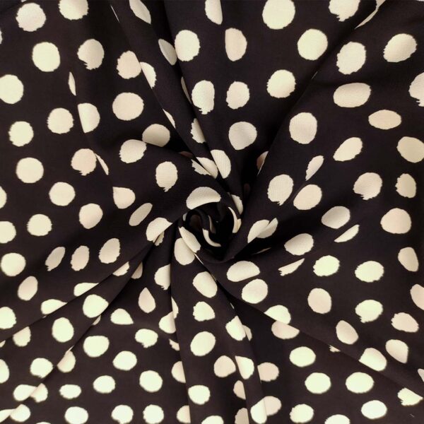 Tessuto Crepe a fantasia motivo pois nero - avorio