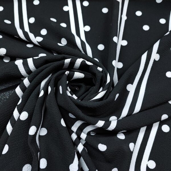 Tessuto Crepe a fantasia motivo pois nero - bianco