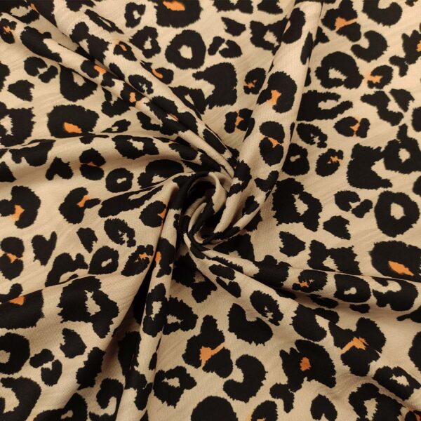 Tessuto Crepe elasticizzato a fantasia motivo animalier beige - arancio  - nero