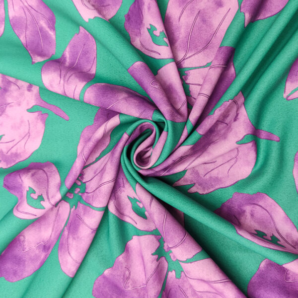 Tessuto Crepe elasticizzato a fantasia motivo floreale smeraldo - orchidea