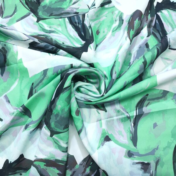 Tessuto Crepe a fantasia motivo floreale verde - nero