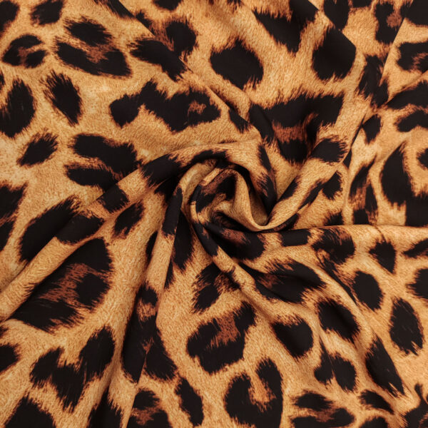 Tessuto Crepe morbido Elegance a fantasia motivo animalier marrone - marroncino