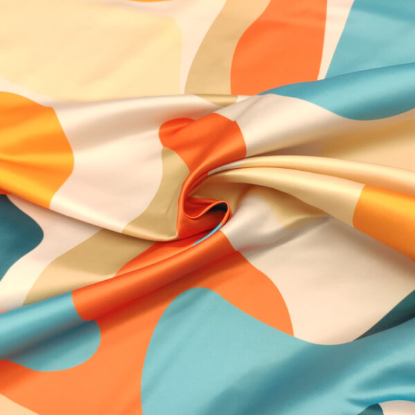 Tessuto Duchesse a fantasia motivo astratto turchese - arancio - panna