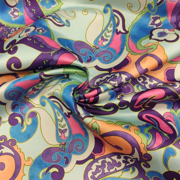 Tessuto Duchesse a fantasia motivo astratto viola - azzurro - turchese