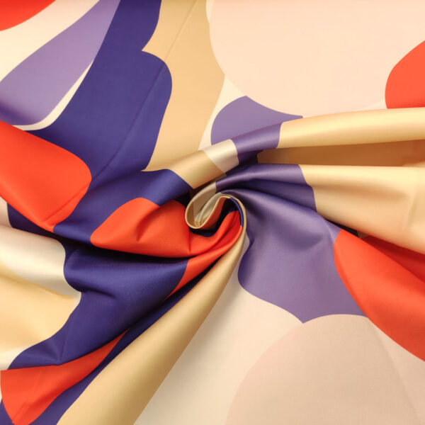 Tessuto Duchesse a fantasia motivo astratto viola - lilla - arancione