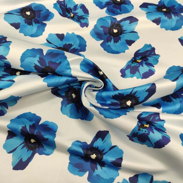 Tessuto Duchesse a fantasia motivo floreale bianco - blu elettrico