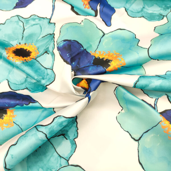 Tessuto Duchesse a fantasia motivo floreale bianco - turchese - blu