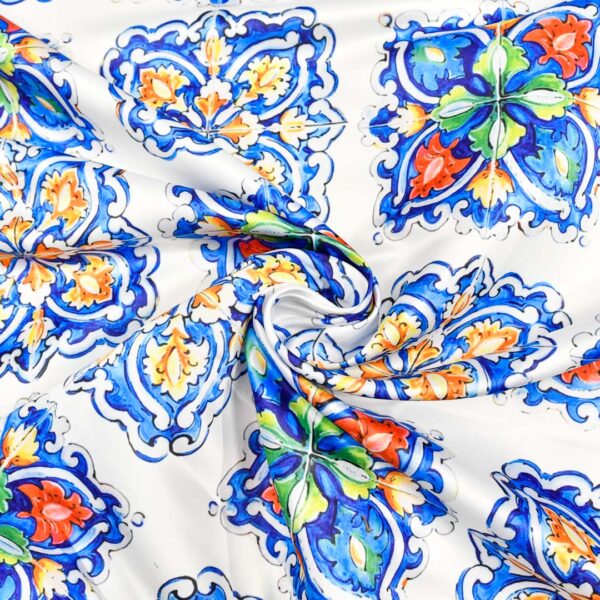 Tessuto Duchesse a fantasia motivo geometrico blu elettrico - rosso - bianco