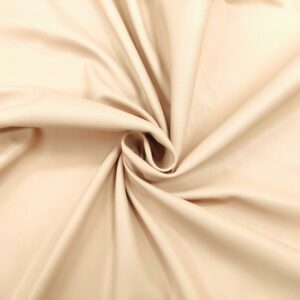 Tessuto Ecopelle leggera per abbigliamento doppiata con camoscio tinta unita beige chiaro