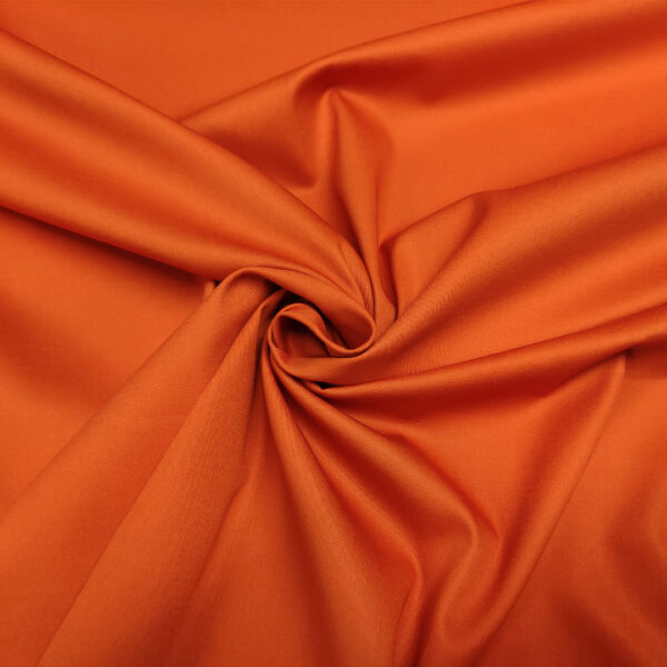 Tessuto Gabardine di cotone tinta unita arancione scuro