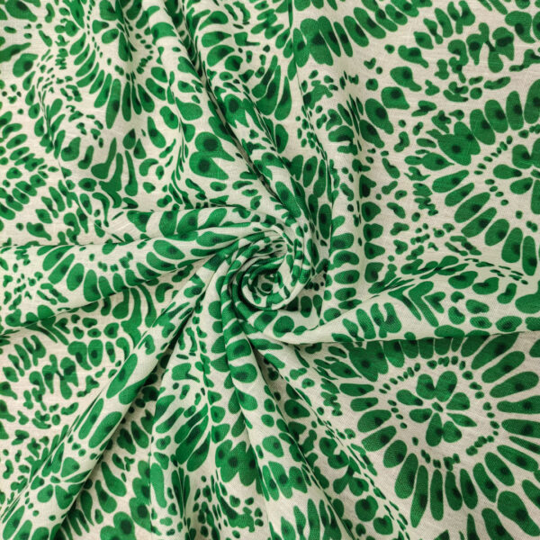 Tessuto Garza di lino a fantasia motivo astratto bianco - verde prato