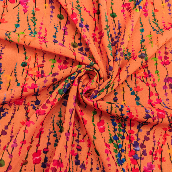 Tessuto Georgette a fantasia motivo astratto arancione - viola - verde