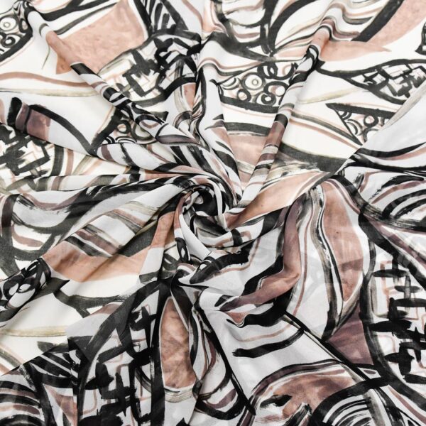 Tessuto Georgette a fantasia motivo astratto beige - nero