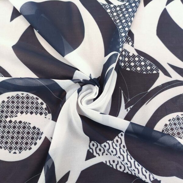 Tessuto Georgette a fantasia motivo astratto bianco - blu