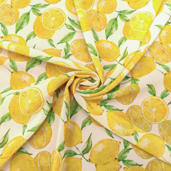 Tessuto Georgette a fantasia motivo astratto burro - giallo - verde