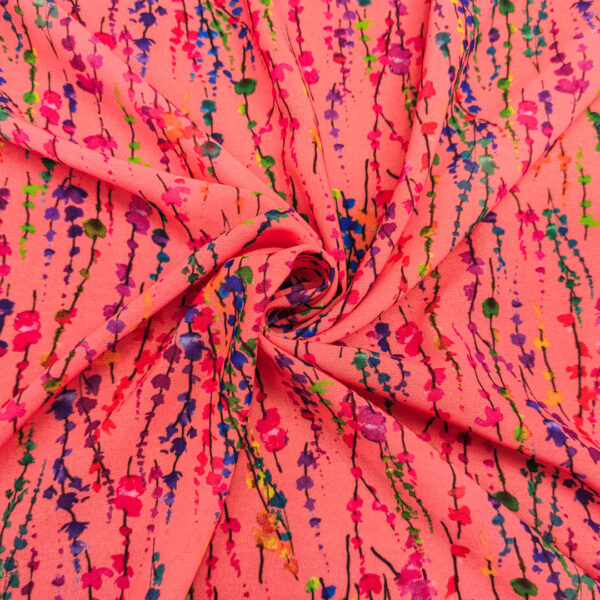 Tessuto Georgette a fantasia motivo astratto corallo - verde - viola