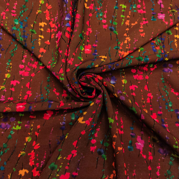 Tessuto Georgette a fantasia motivo astratto marrone - fucsia - arancio