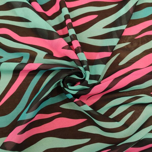 Tessuto Georgette a fantasia motivo astratto nero - fucsia - ottanio