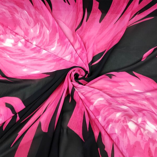 Tessuto Georgette a fantasia motivo astratto nero - fucsia
