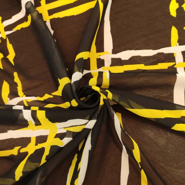 Tessuto Georgette a fantasia motivo astratto nero - giallo - bianco