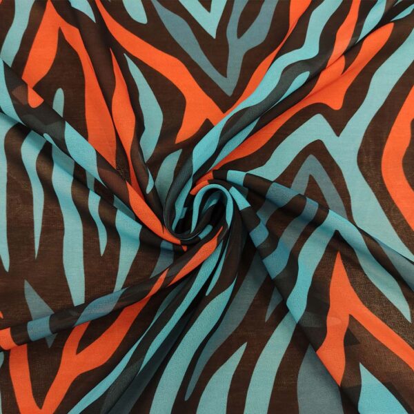 Tessuto Georgette a fantasia motivo astratto nero - turchese - arancio