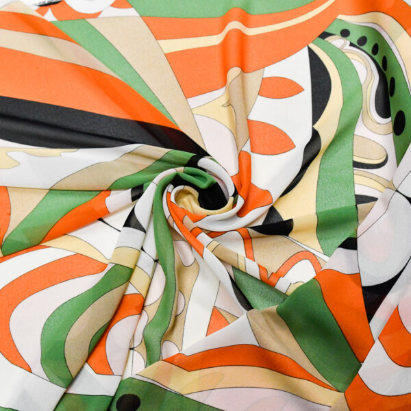 Tessuto Georgette a fantasia motivo astratto verde - arancione - bianco - nero