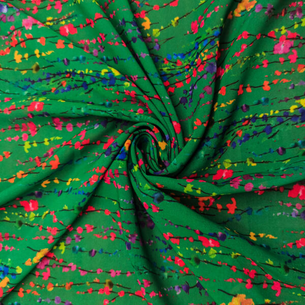 Tessuto Georgette a fantasia motivo astratto verde - fucsia - blu elettrico