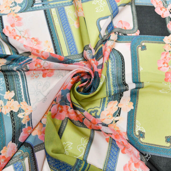 Tessuto Georgette a fantasia motivo astratto verde petrolio - corallo