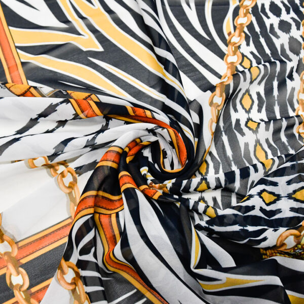 Tessuto Georgette a fantasia motivo astratto blu - giallo