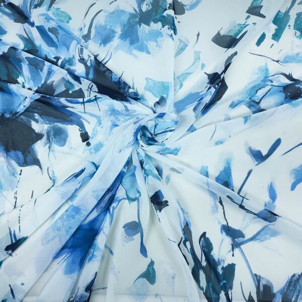 Tessuto Georgette a fantasia motivo floreale bianco - turchese - blu