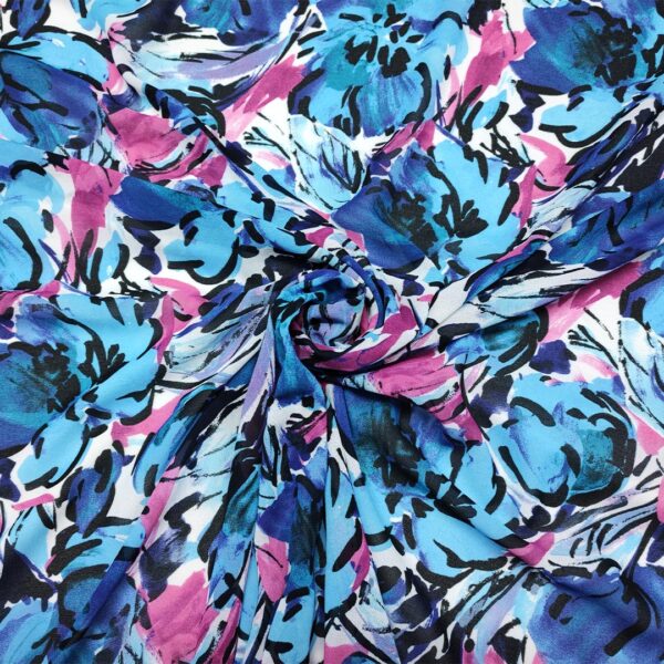 Tessuto Georgette a fantasia motivo floreale blu - turchese - fucsia
