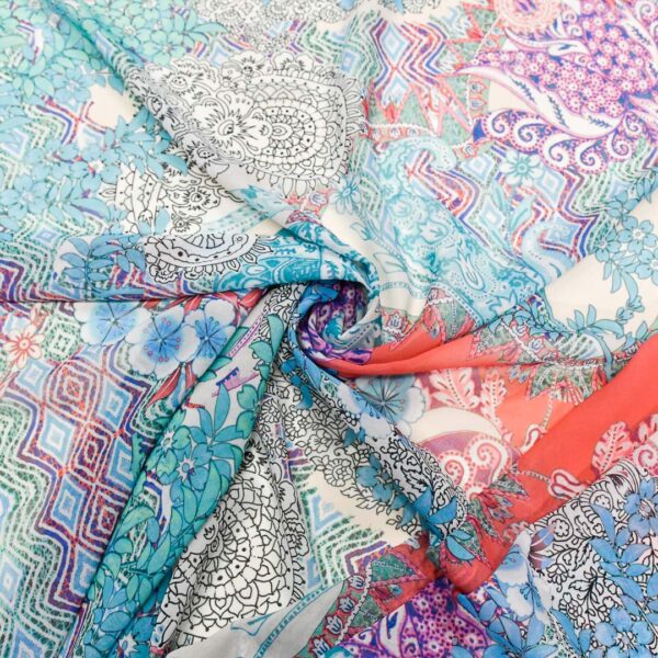 Tessuto Georgette a fantasia motivo floreale cashmere turchese - corallo