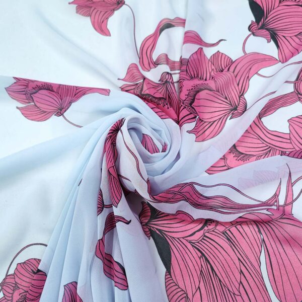 Tessuto Georgette a fantasia motivo floreale celeste - fucsia - nero