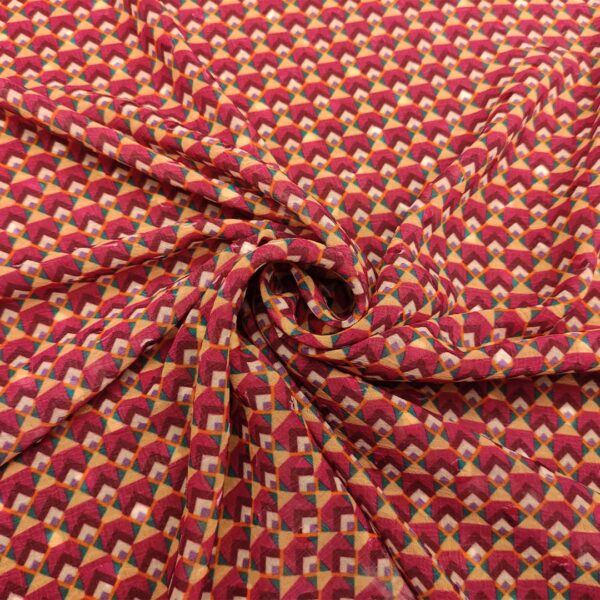 Tessuto Georgette a fantasia motivo geometrico magenta - fucsia - arancione - verde ottanio