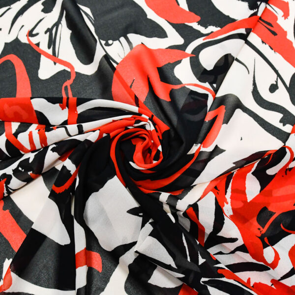 Tessuto Georgette a fantasia motivo astratto panna - nero - rosso