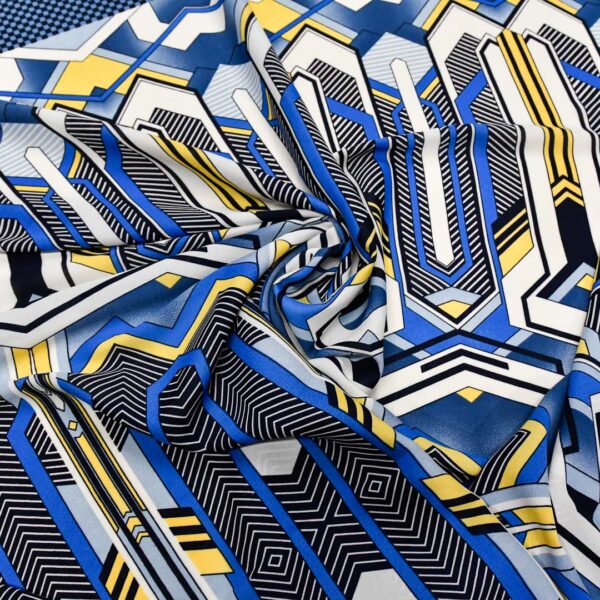 Tessuto Georgette a fantasia motivo geometrico blu - giallo - bianco