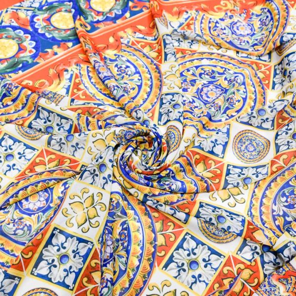 Tessuto Georgette a fantasia motivo floreale barocco blu elettrico - arancione - giallo