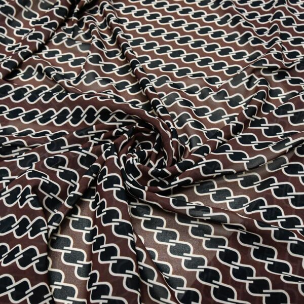 Tessuto Georgette a fantasia motivo geometrico nero - marrone