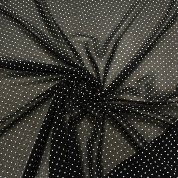 Tessuto Georgette a fantasia motivo pois piccoli nero - bianco
