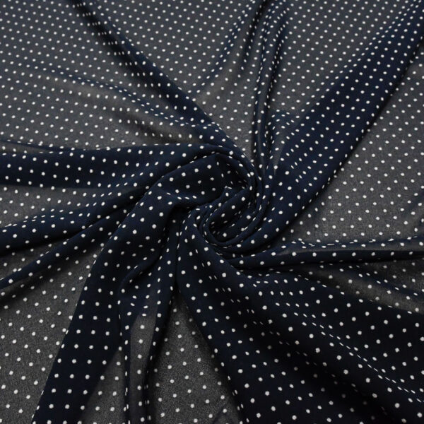 Tessuto Georgette a fantasia motivo pois piccoli blu - bianco