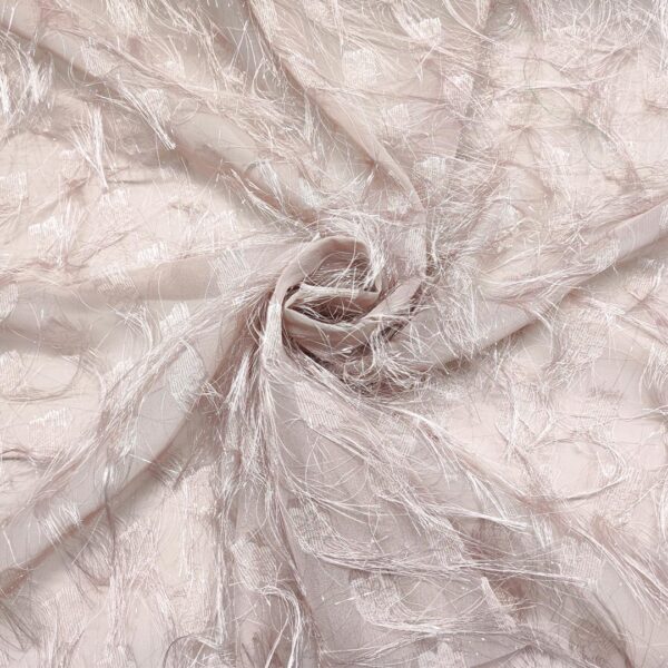 Tessuto Georgette con frange rosa cipria