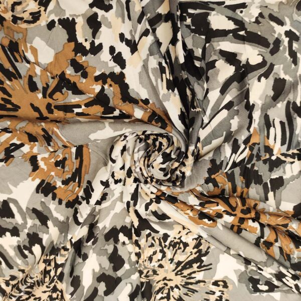 Tessuto Jersey a fantasia motivo astratto grigio - marrone - bianco